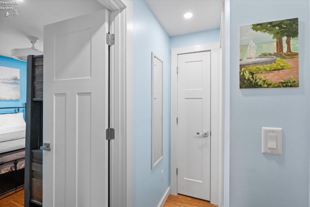 corridor featuring light hardwood / wood-style flooring