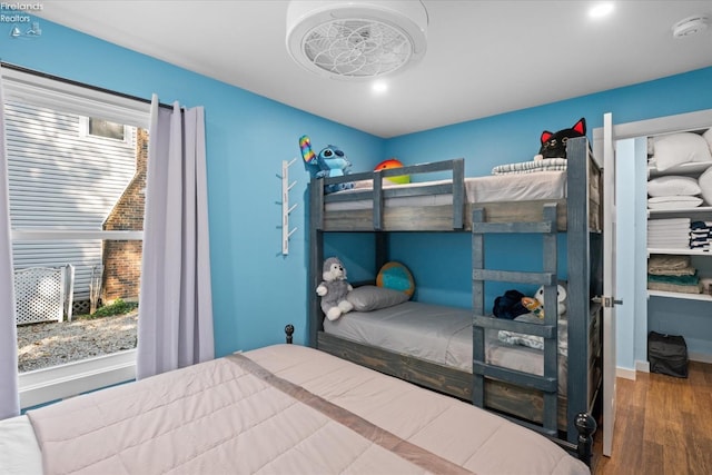 bedroom with hardwood / wood-style floors