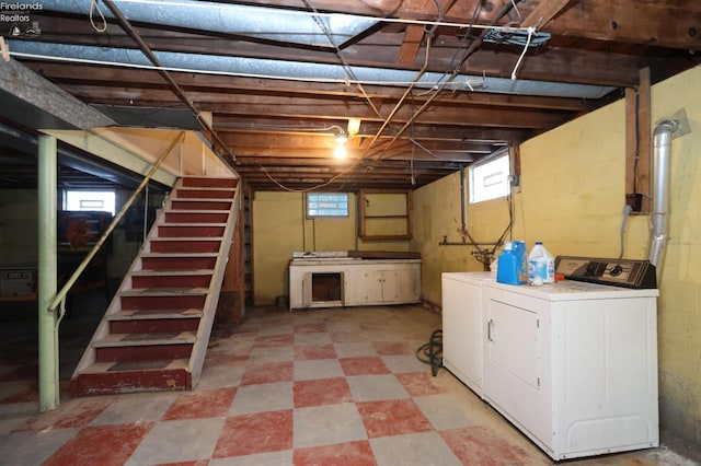 basement with washing machine and clothes dryer