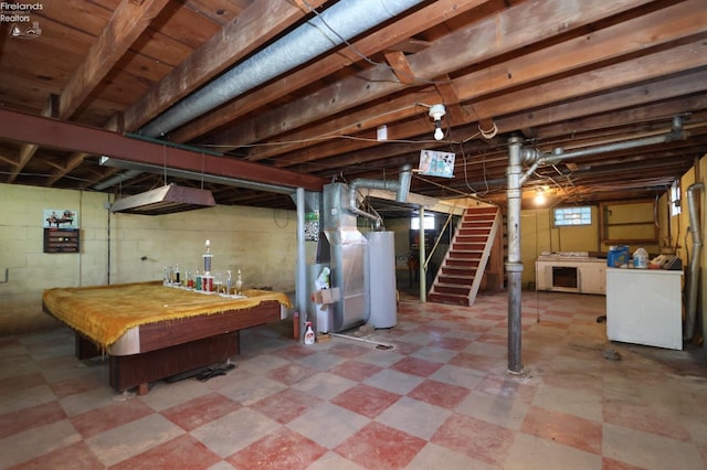 basement featuring washer / dryer, heating unit, billiards, and water heater