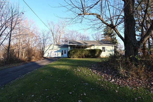 view of front facade with a front lawn and a garage