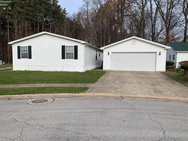 view of front facade with a garage, an outdoor structure, and a front yard