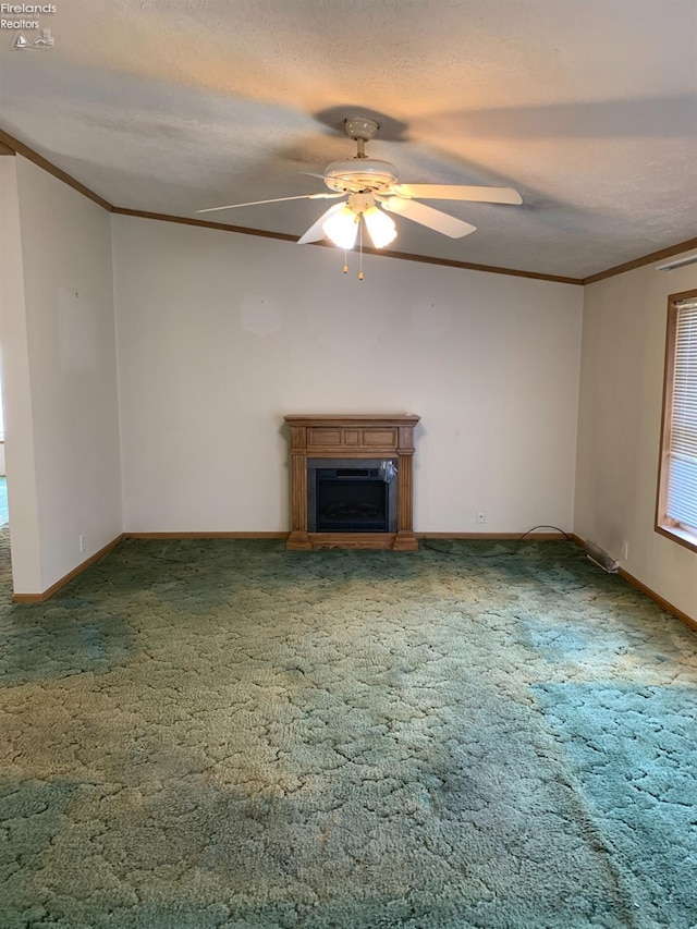 unfurnished living room with carpet, ceiling fan, and ornamental molding