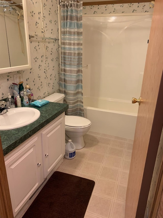 full bathroom featuring shower / bath combination with curtain, vanity, and toilet