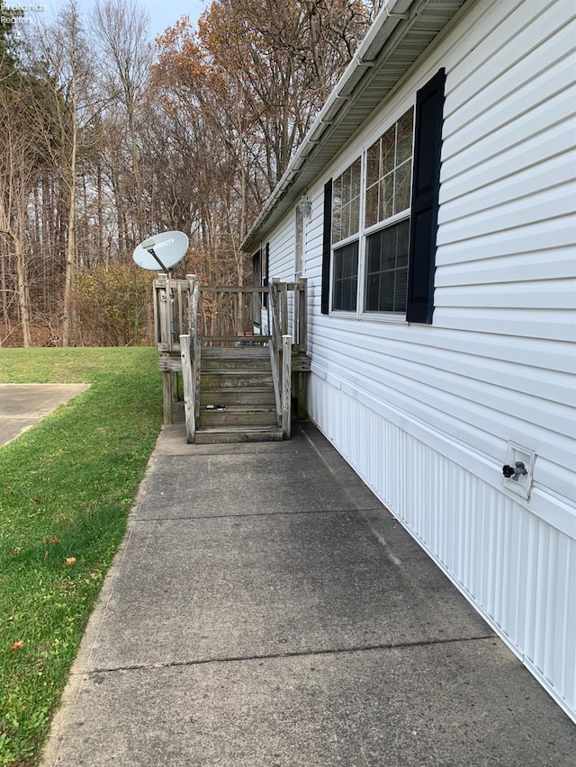 view of home's exterior with a lawn