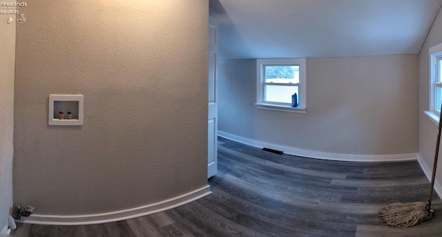 interior space with vaulted ceiling and hardwood / wood-style floors