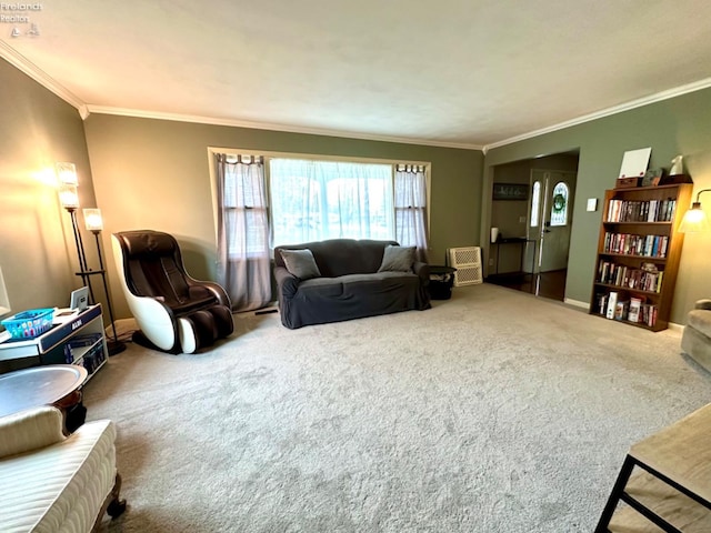 carpeted living room with ornamental molding