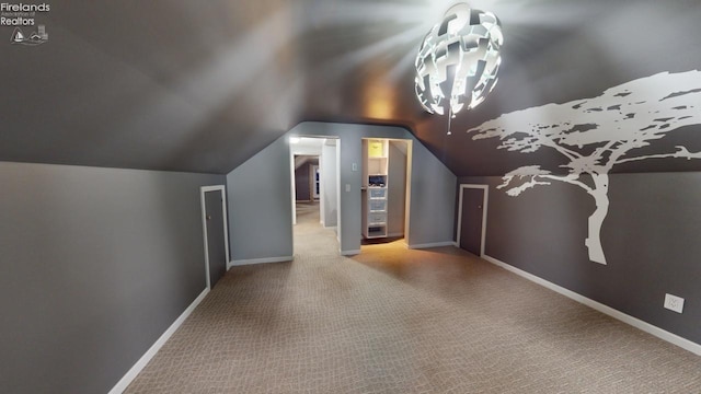 bonus room featuring carpet floors and lofted ceiling