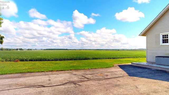 view of yard with a rural view