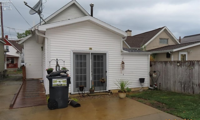 rear view of house with a patio area and french doors