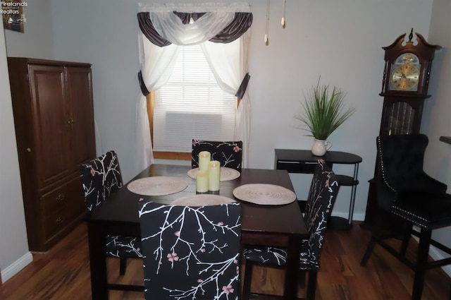 dining area featuring dark hardwood / wood-style floors