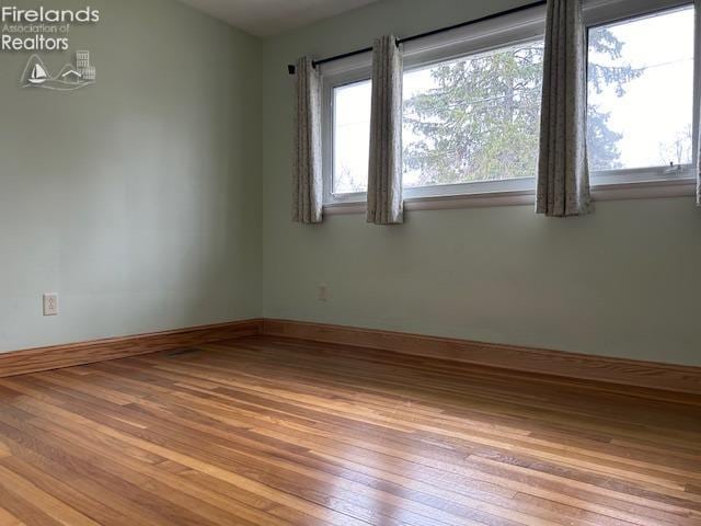 empty room featuring light hardwood / wood-style floors