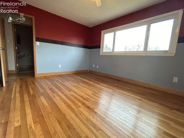 empty room featuring hardwood / wood-style floors