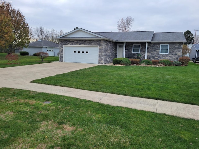 single story home featuring a front lawn and a garage