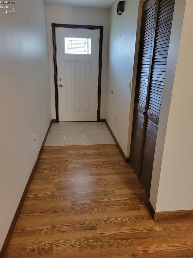 doorway to outside with light hardwood / wood-style flooring