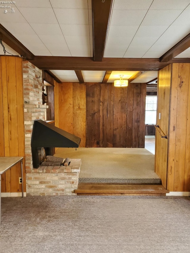 basement with carpet floors and wood walls