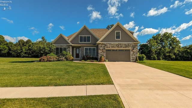 craftsman house with a front yard and a garage