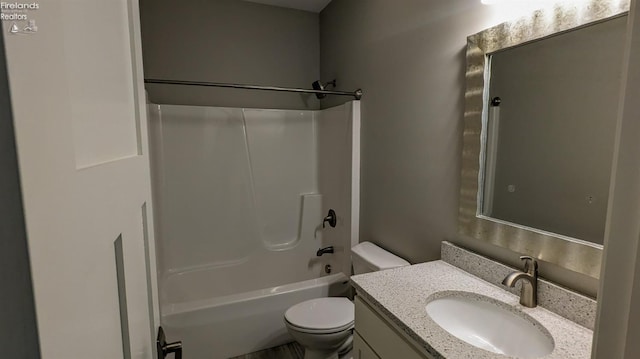 full bathroom with vanity, toilet, and shower / washtub combination