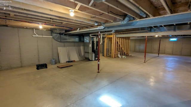 basement featuring heating unit