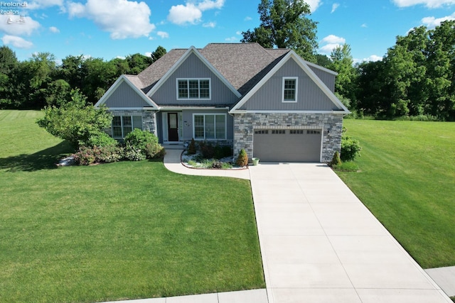 craftsman-style house featuring a front yard and a garage