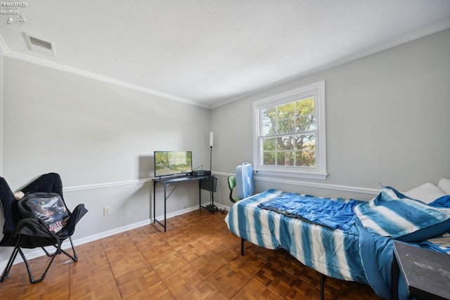 bedroom with a textured ceiling, parquet floors, and crown molding