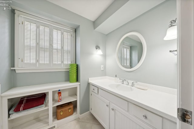 bathroom featuring tile patterned flooring and vanity