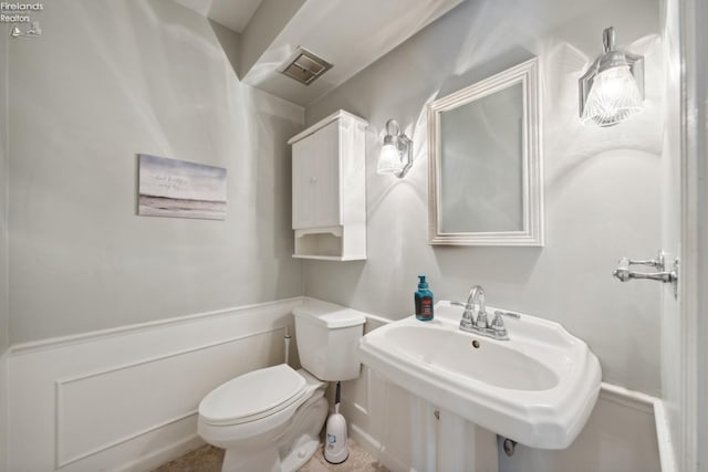 bathroom featuring sink and toilet