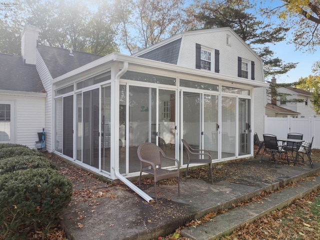 view of side of property featuring a sunroom