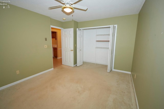 unfurnished bedroom with light carpet, a closet, and ceiling fan