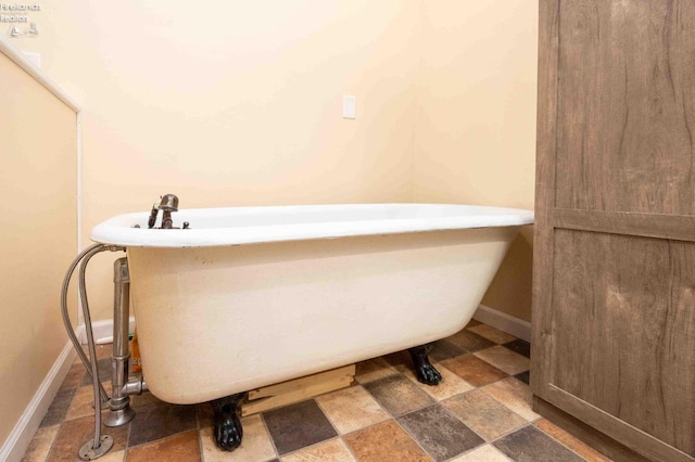 bathroom with a washtub