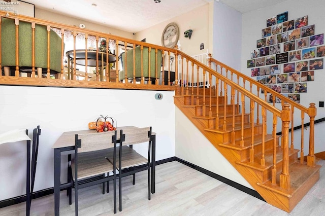 staircase featuring hardwood / wood-style flooring