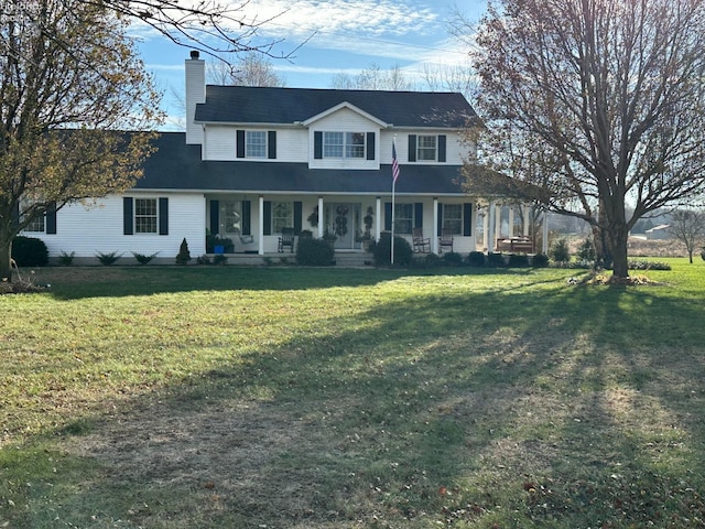 view of front facade with covered porch and a front lawn