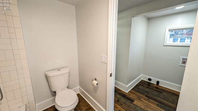 bathroom featuring toilet and wood-type flooring