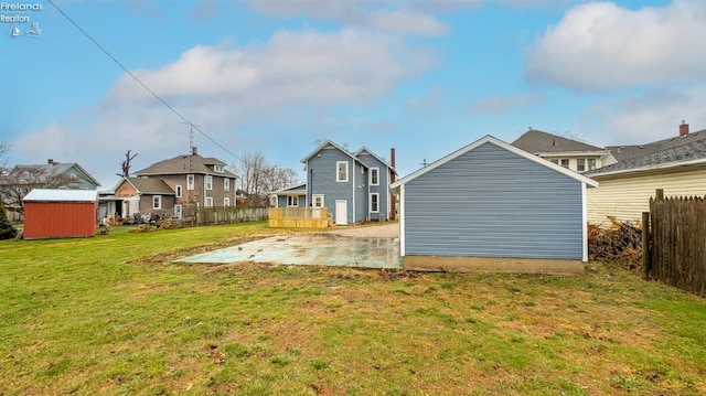 view of yard featuring a patio area and a shed