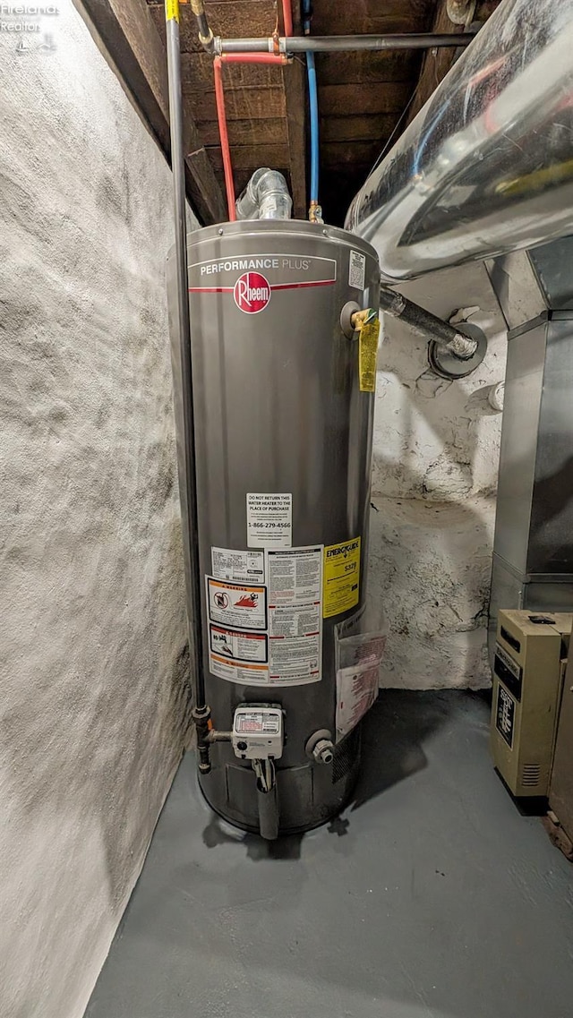 utility room with gas water heater