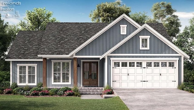 view of front of house featuring a front yard and a garage