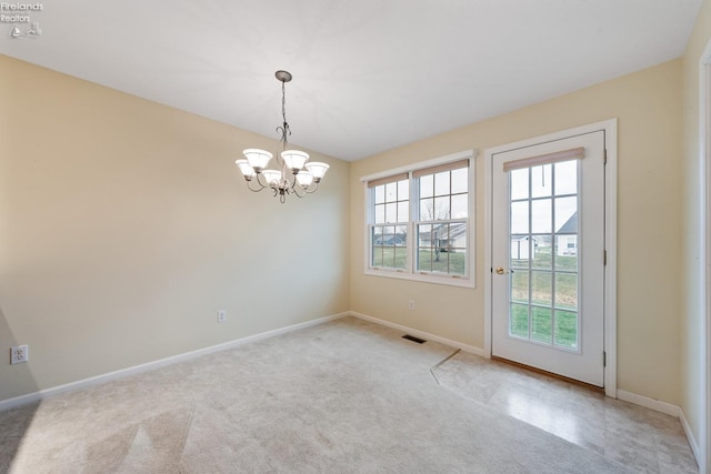 unfurnished room with light colored carpet and a notable chandelier