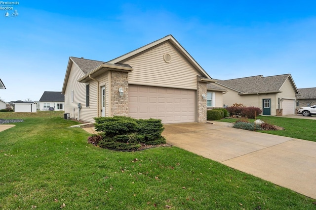 single story home featuring a front yard and a garage