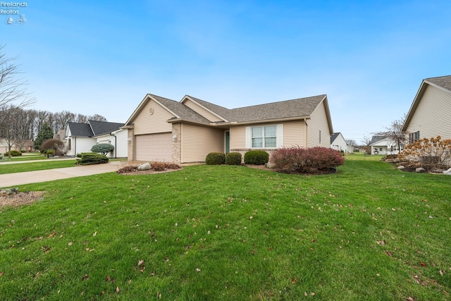 view of front facade with a front yard and a garage