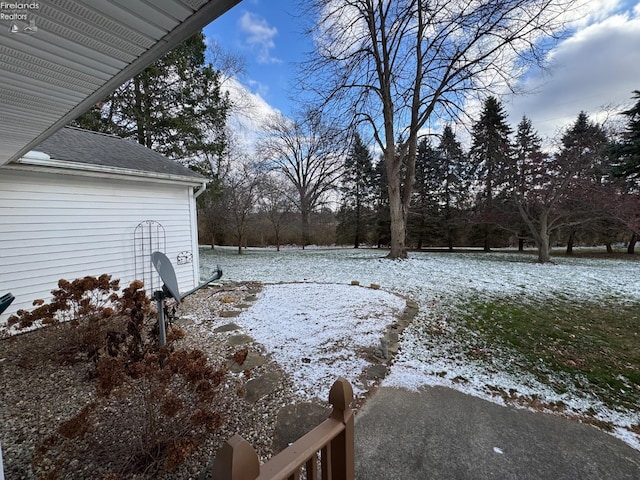 view of yard covered in snow