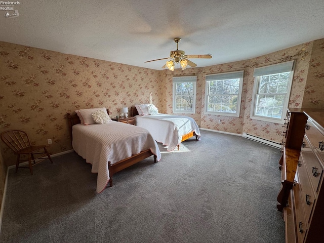 bedroom with dark colored carpet, a textured ceiling, ceiling fan, and a baseboard heating unit