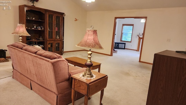 carpeted living room featuring ceiling fan