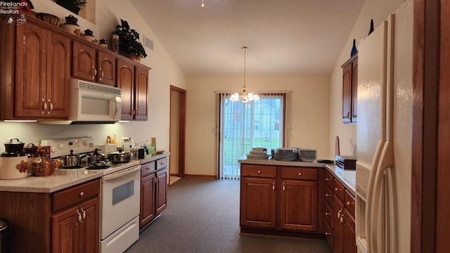 kitchen featuring white appliances, vaulted ceiling, dark colored carpet, a notable chandelier, and hanging light fixtures