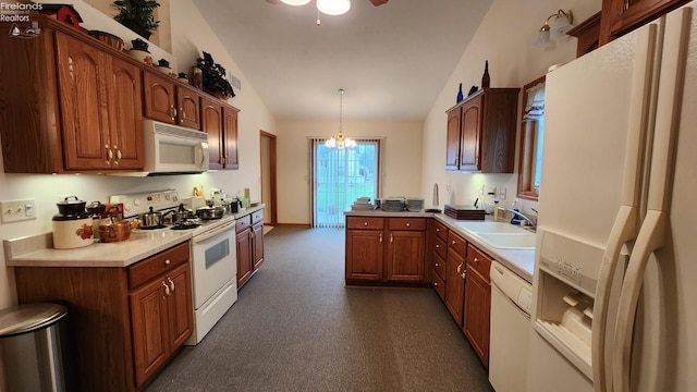 kitchen with sink, hanging light fixtures, a notable chandelier, lofted ceiling, and white appliances