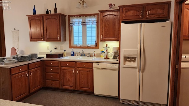 kitchen with white appliances and sink