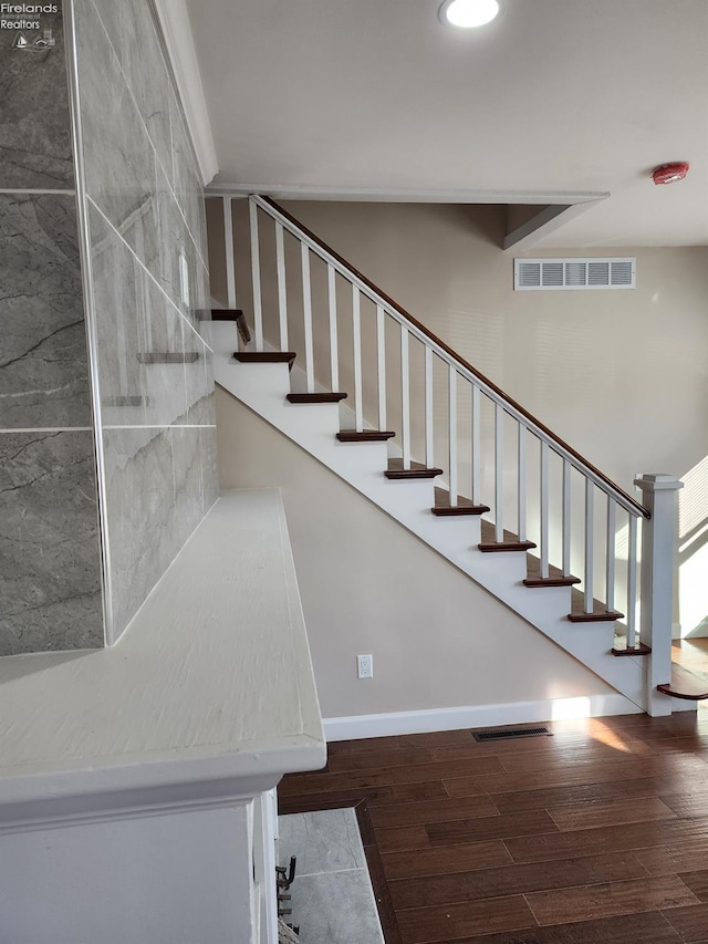 stairs with wood-type flooring