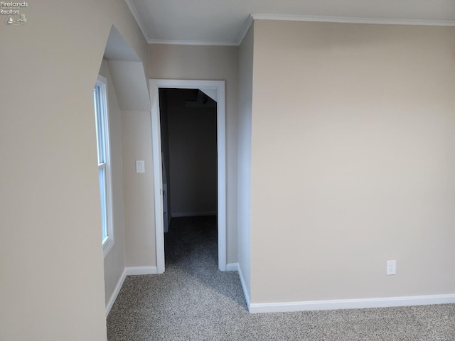 hall with carpet flooring and crown molding