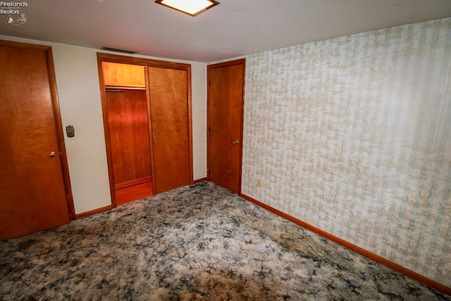 unfurnished bedroom with a closet