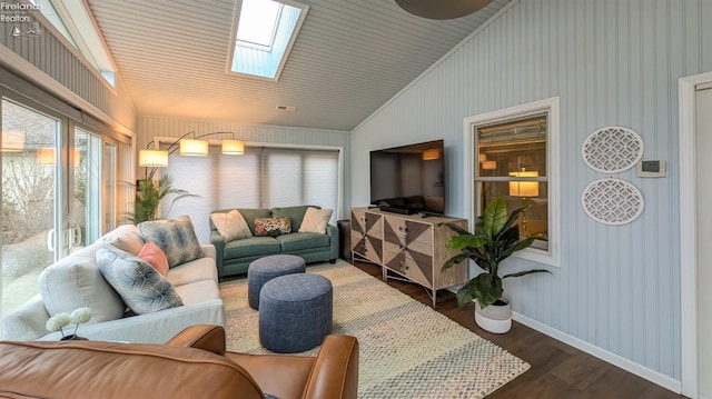 sunroom featuring lofted ceiling with skylight and plenty of natural light