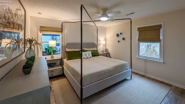 bedroom with ceiling fan and hardwood / wood-style floors